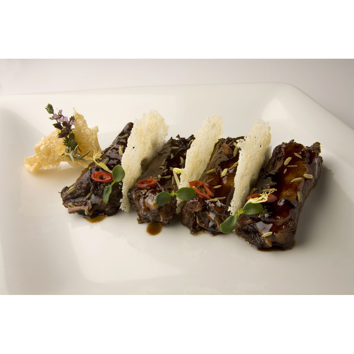 5 spice pork spare-ribs with Grana Padano crisps