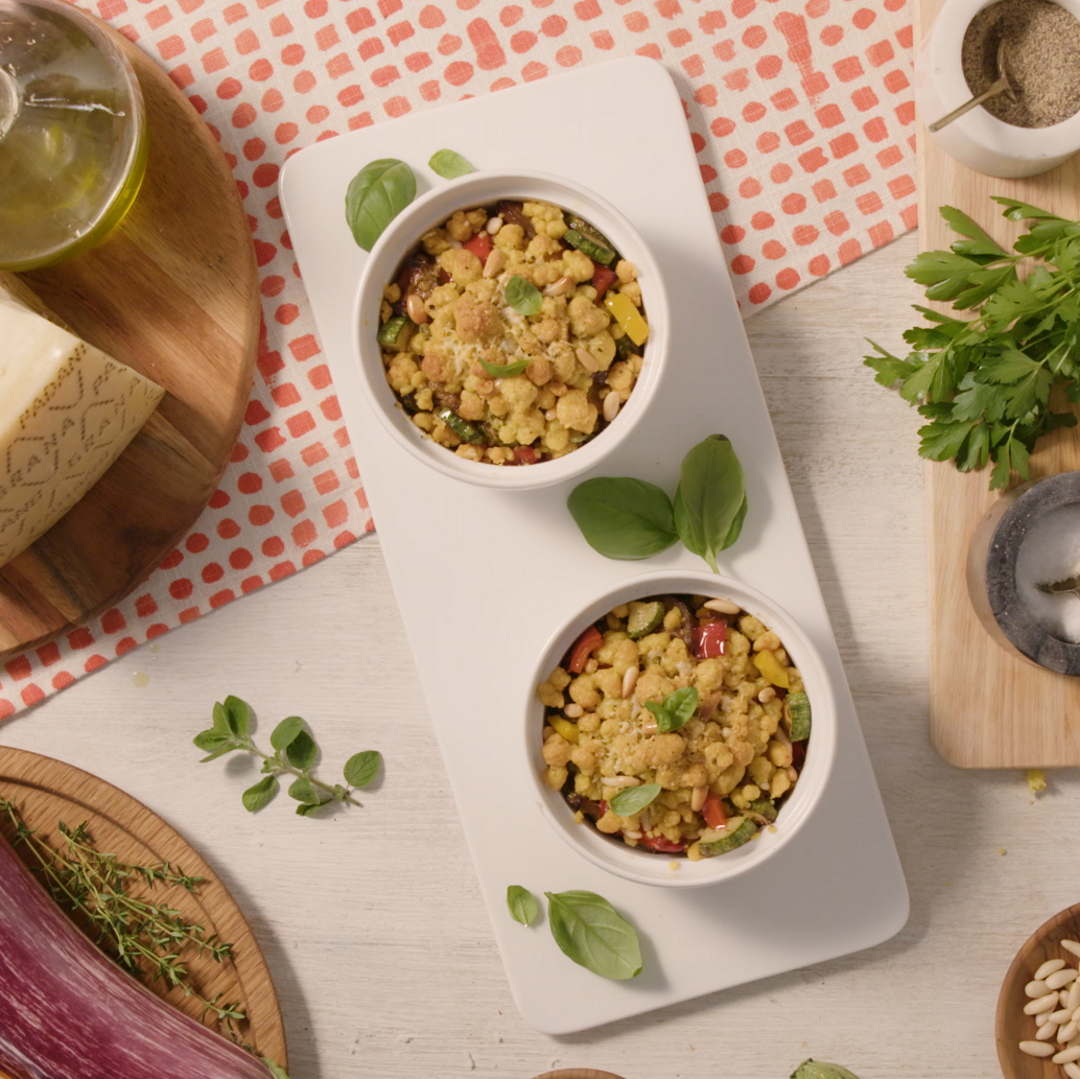 Savoury crumble with seasonal vegetables, pine nuts and Grana Padano