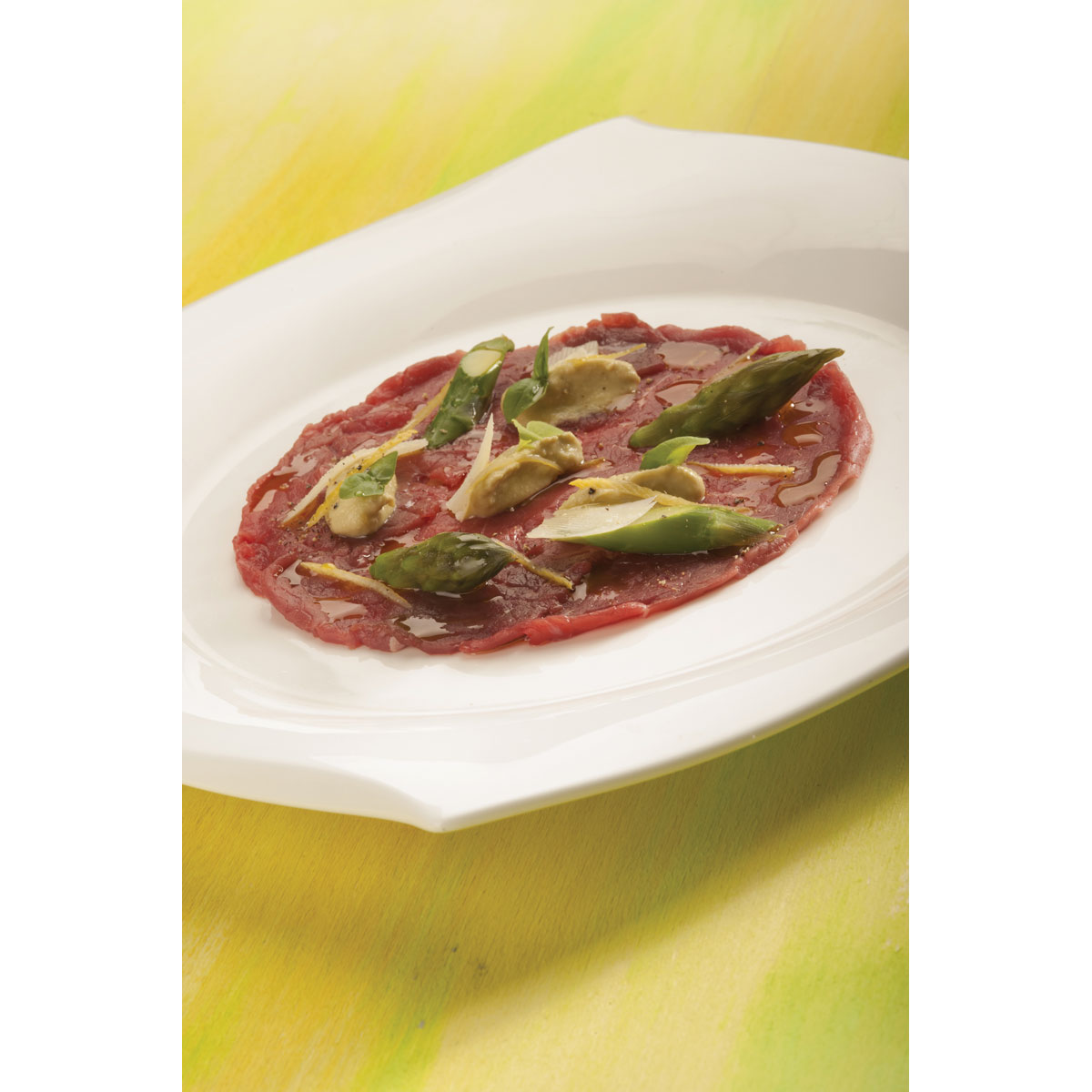 Carpaccio di vitellone, Grana Padano mantecato al basilico e asparagi