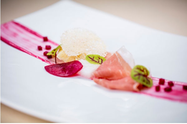 Composition of Prosciutto San Daniele and red beets on Grana Padano puff