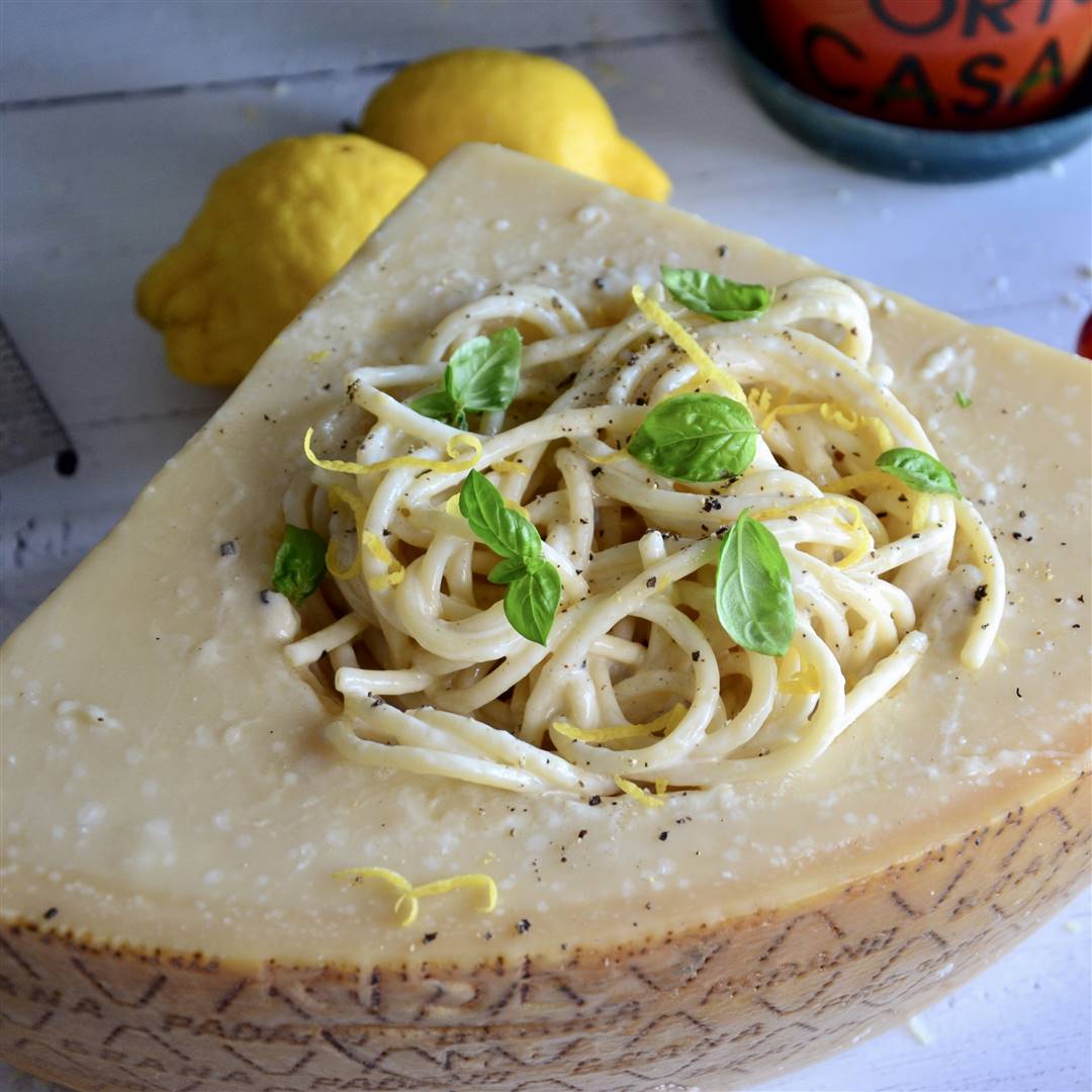 Bucatini cacio e pepe with Grana Padano, lemon and basil
