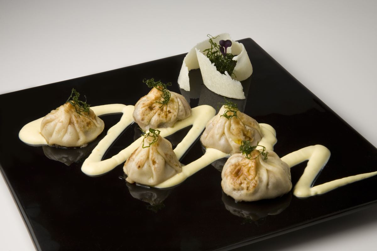 Dumplings au gratin in a Grana Padano sauce 