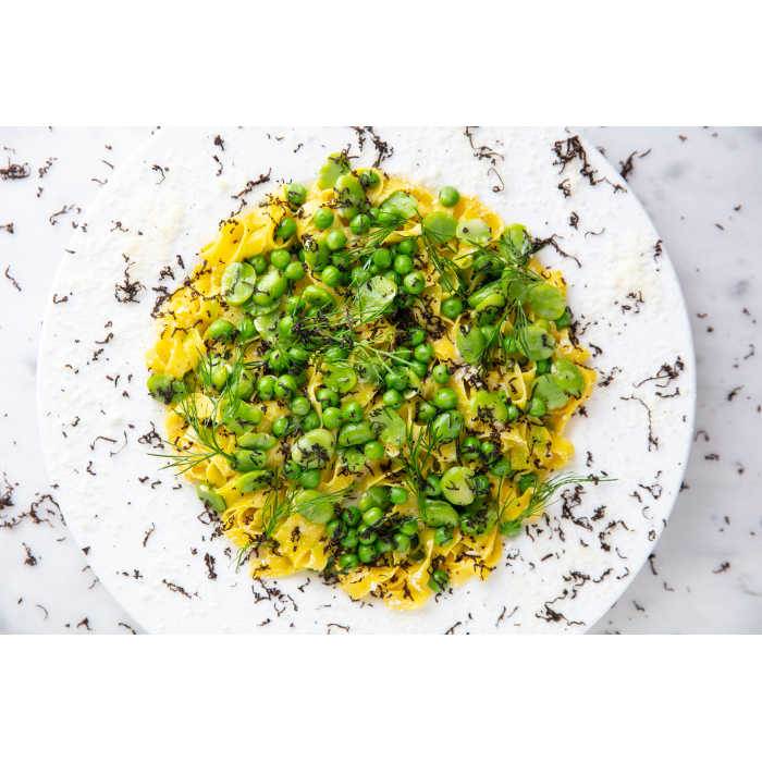 Fettucine with Grana Padano Riserva, broad beans, peas and black