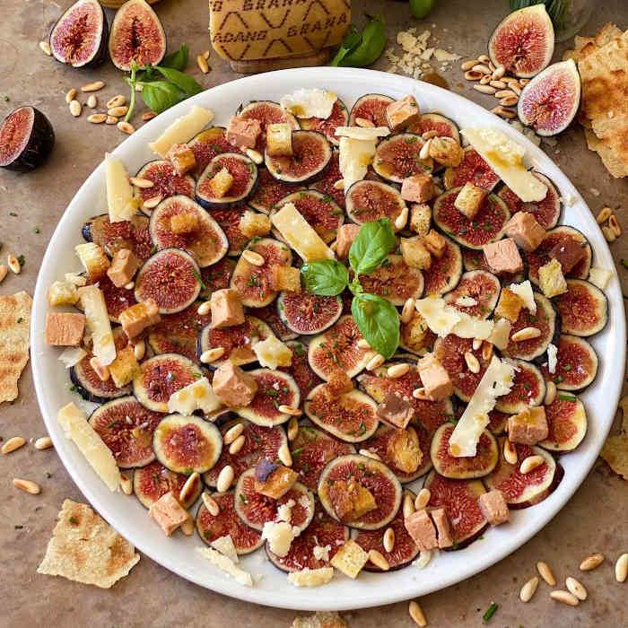 Fig carpaccio with Grana Padano, toasted pinnons, foie mi cuit, fried bread and mustard vinegarette