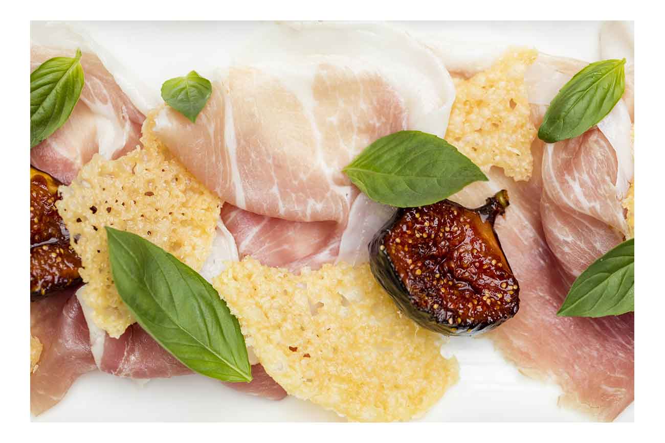 Figs roasted in sherry vinegar caramel, Grana Padano crisps & Prosciutto di San Daniele  