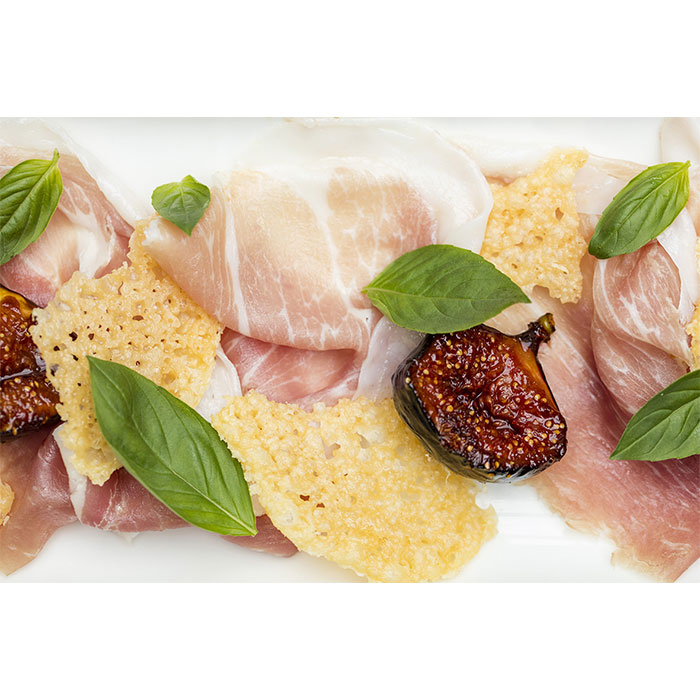 Figs roasted in sherry vinegar caramel, Grana Padano crisps & Prosciutto di San Daniele  
