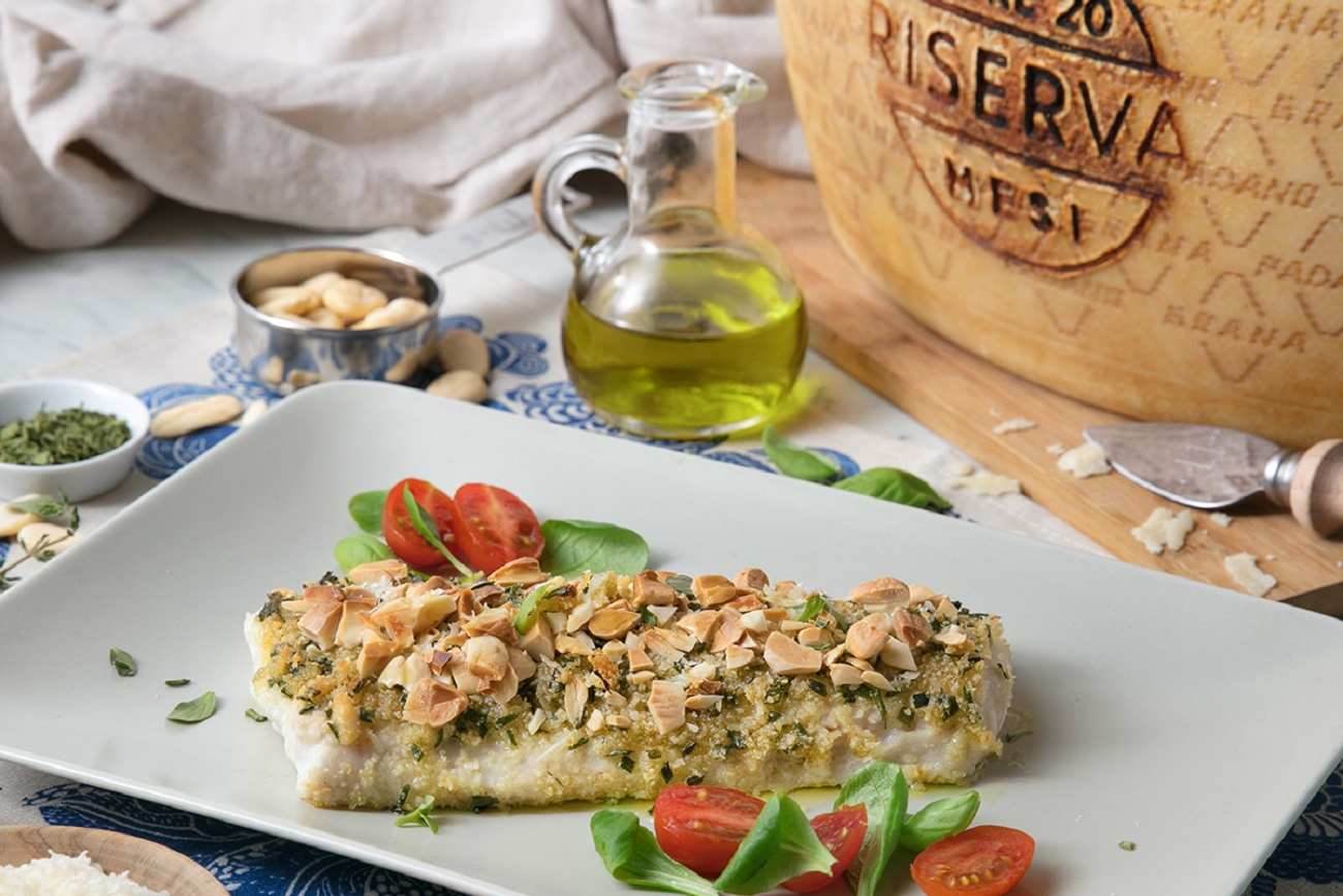 Baked cod fillet in a crust of Grana Padano Riserva, almonds, breadcrumbs and herbs