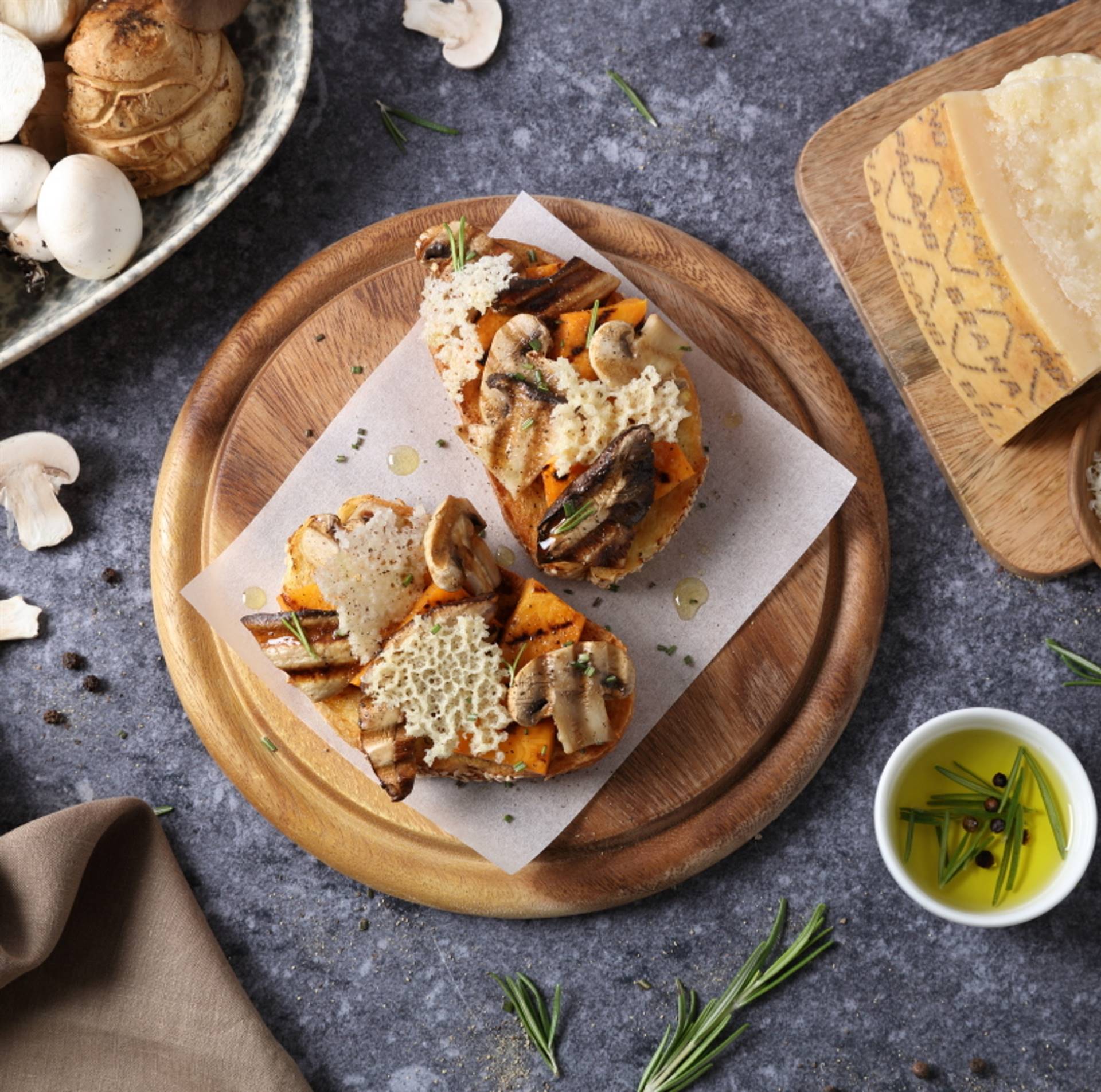 Bruschetta with pumpkin and grilled mushrooms, Grana Padano wafers and rosemary-flavoured oil