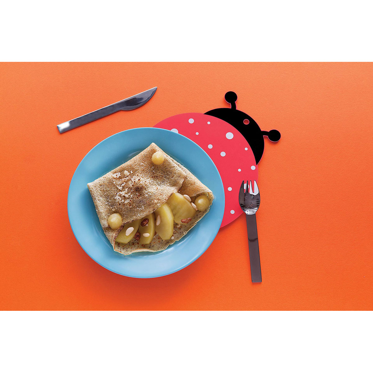 Buckwheat pancakes with Grana Padano, apples, raisins and pine kernels