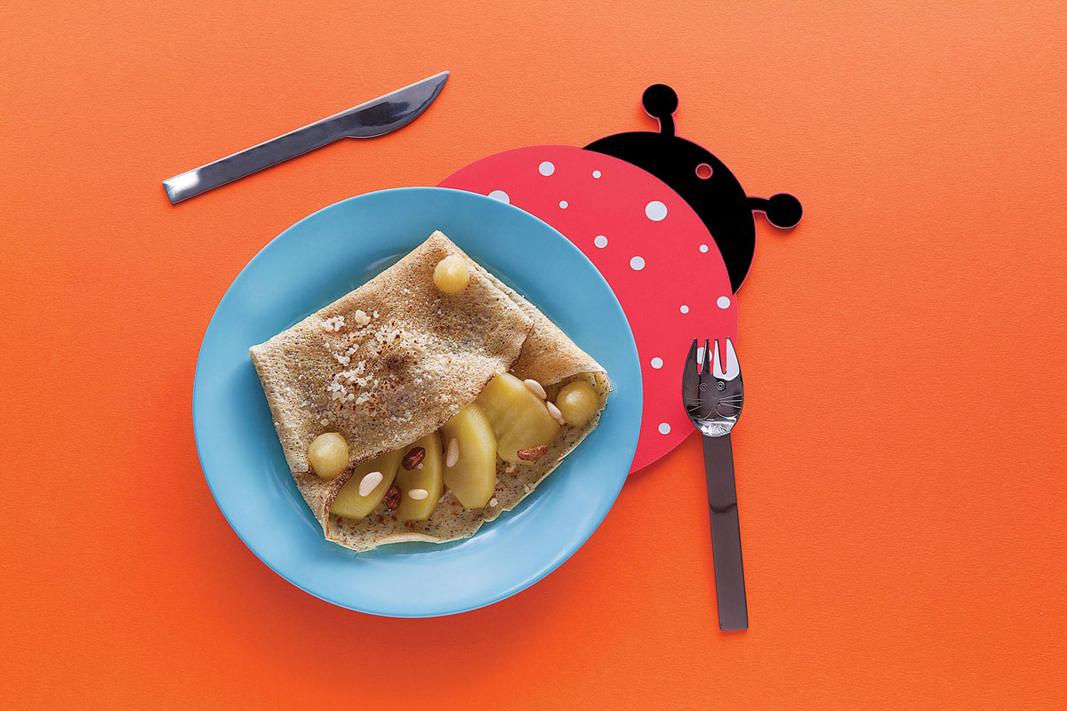 Buckwheat pancakes with Grana Padano, apples, raisins and pine kernels
