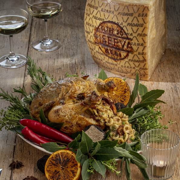 Oven roasted capon, stuffed with anellini pasta, peas, Grana Padano Riserva, sausage and truffle