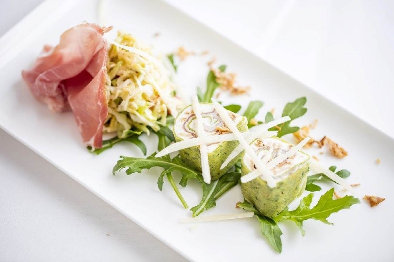 „Kräuterflädle“: German herb pancakes, filled with Prosciutto di San Daniele, cream cheese, roasted onion pesto with coleslaw and Grana Padano 