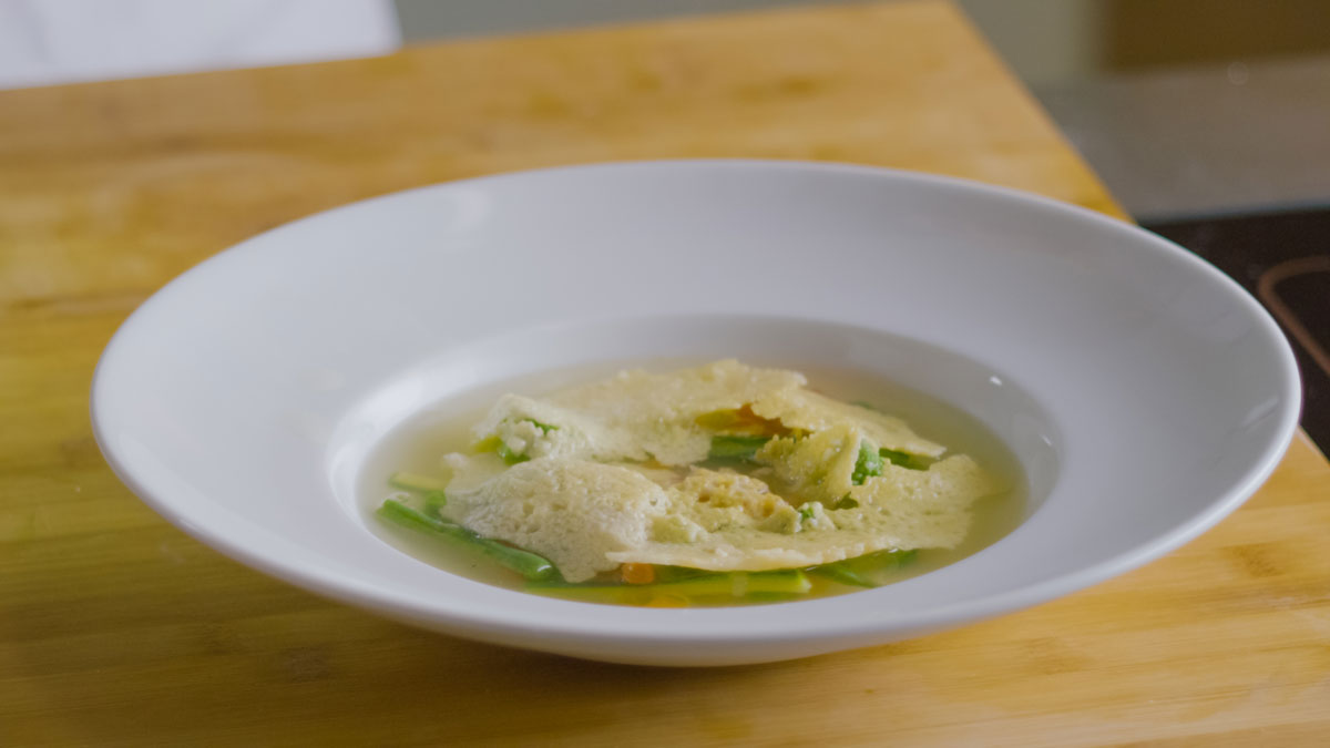Vegetable minestrone soup with Grana Padano crispy crust