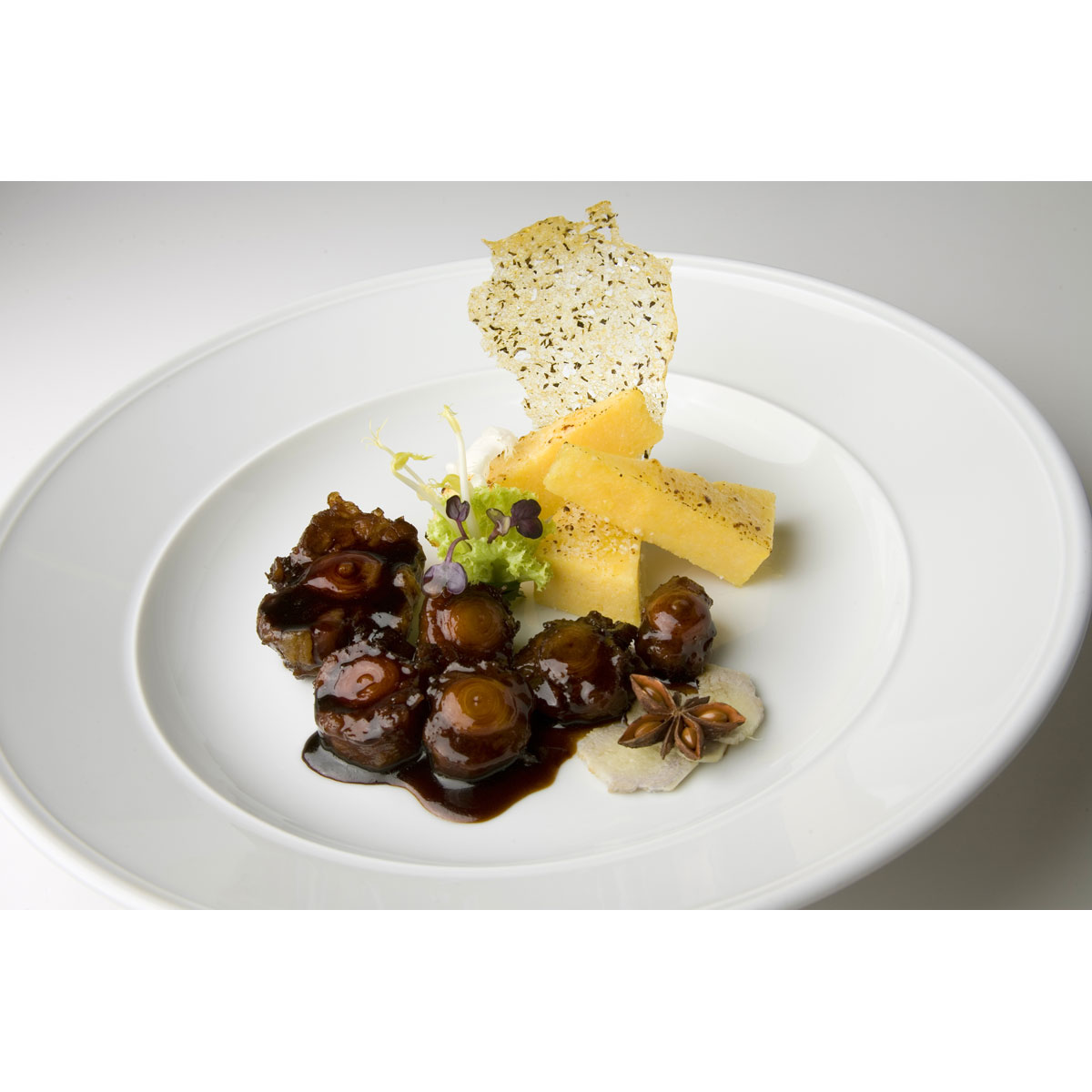 Oxtail simmered in red wine from Valtellina with crispy polenta and Grana Padano