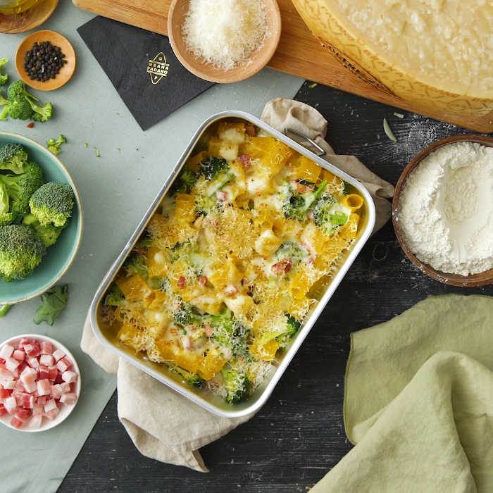 Oven baked pasta with bechamel, broccoli, bacon and Grana Padano Riserva
