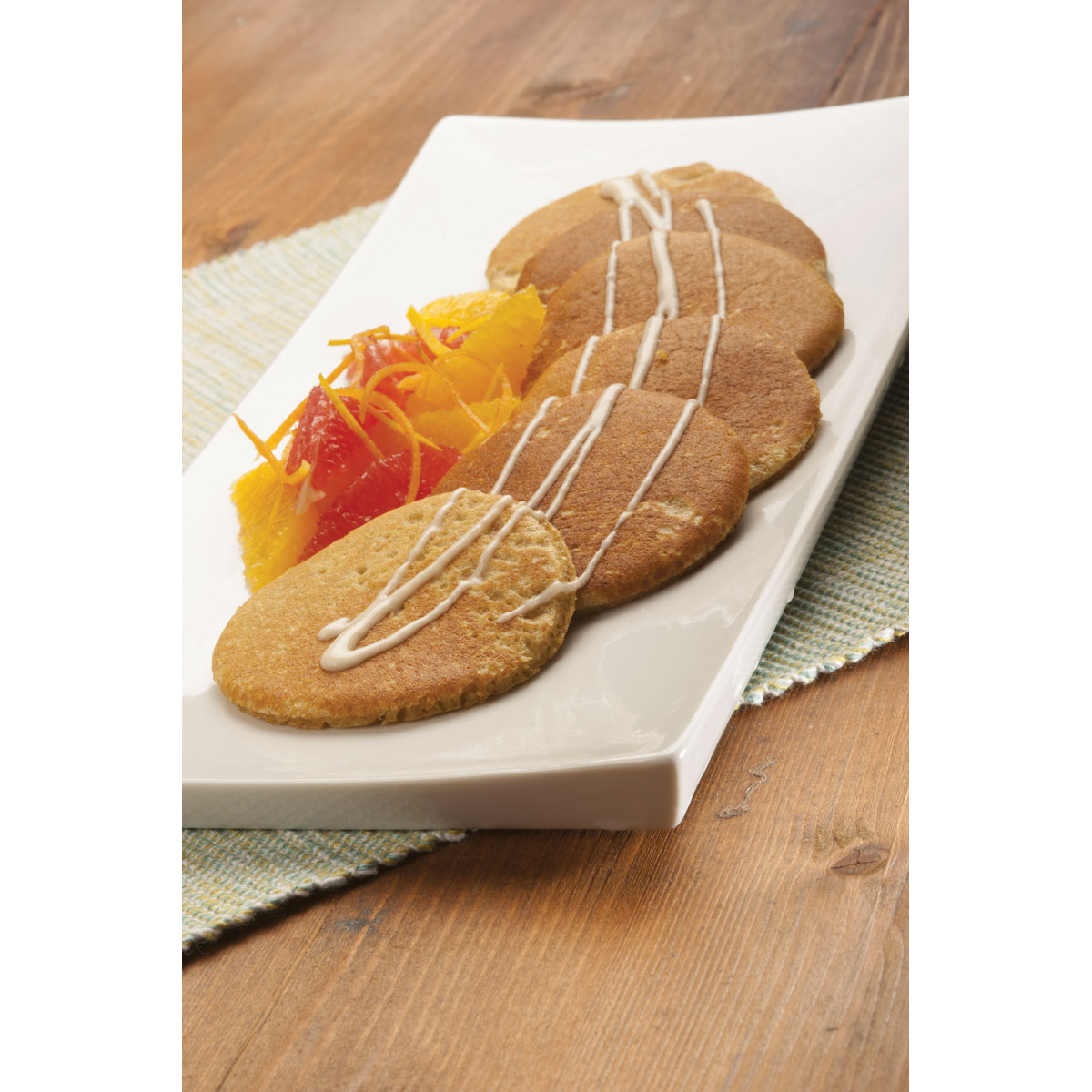 Pancake integrali al Grana Padano, agrumi e crema di banane