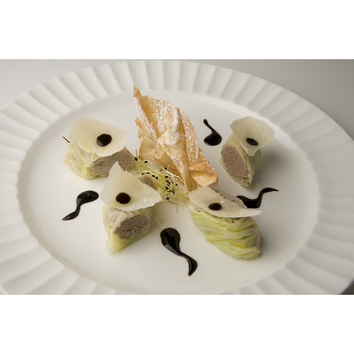 Pork meat with Franciacorta wine in Chinese cabbage rolls