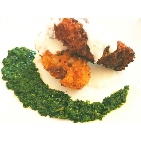 Quenelle di gamberi e calamaro con fonduta di Grana Padano e crema di zucchine profumata al pesto