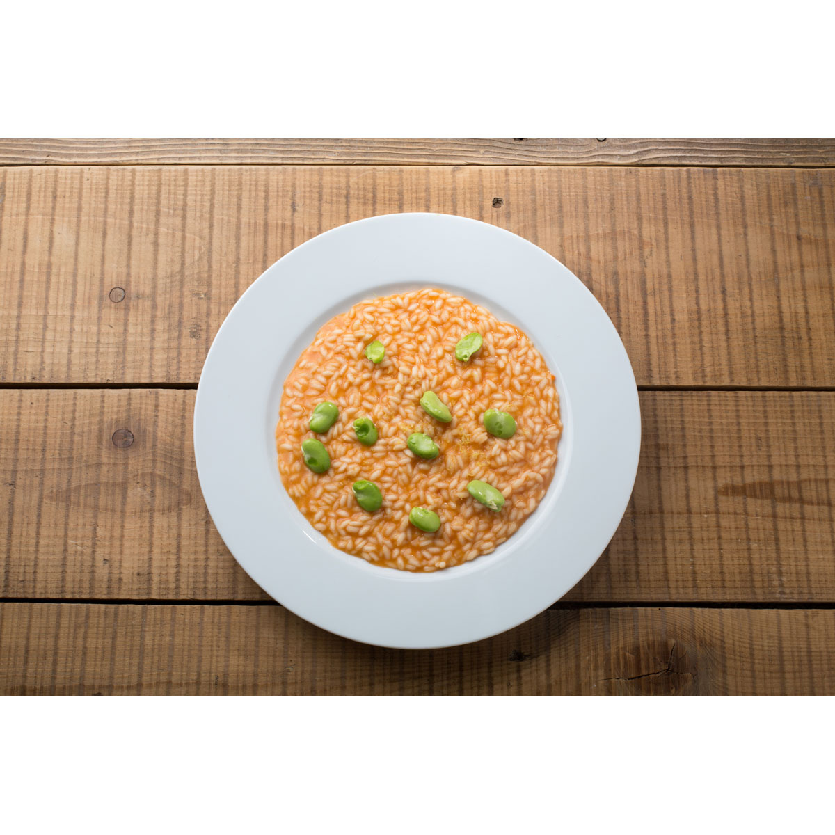 Risotto ai pomodorini arrostiti, fave e Grana Padano