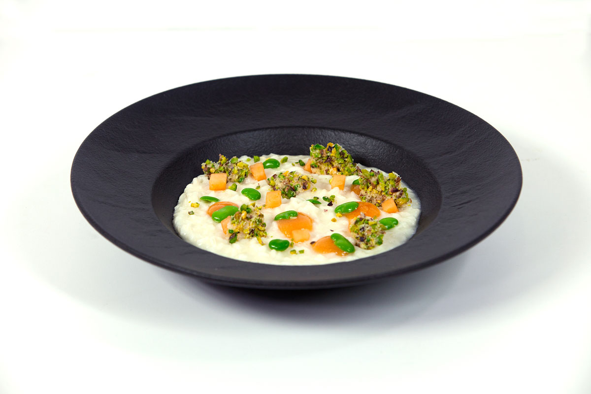 Risotto al Grana Padano Riserva, dolce forte forte di melone e croccante di Grana Padano ai pistacchi