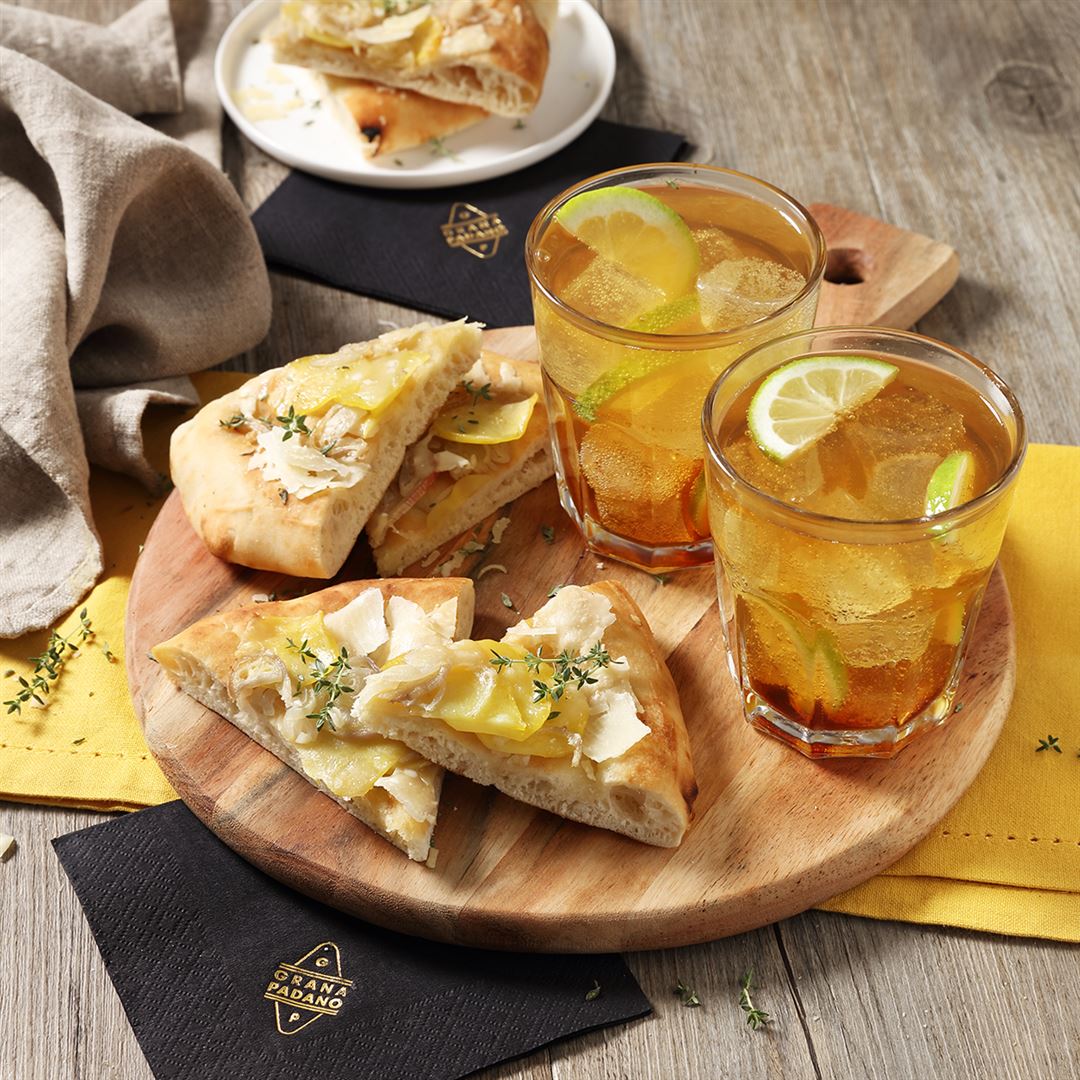 Cynar Spritz served with Focaccia garnished with Potatoes, Onions and Grana Padano Riserva