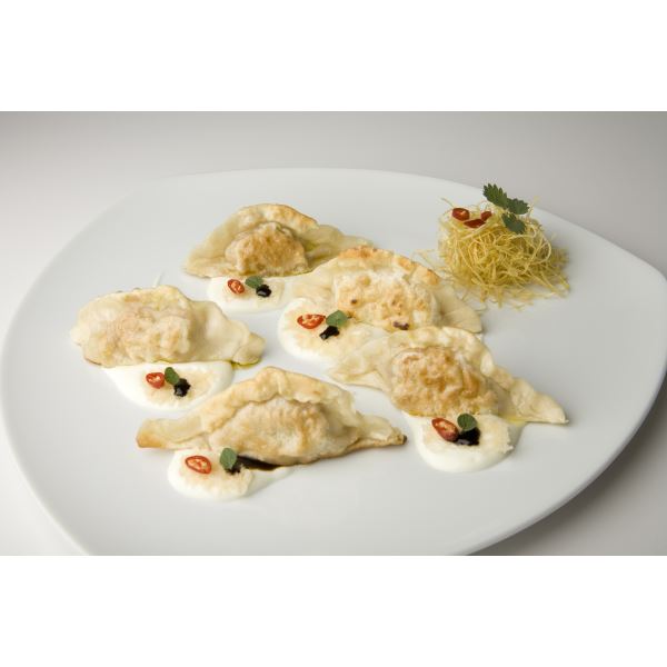 Sautéed dumplings with a Taleggio cheese cream