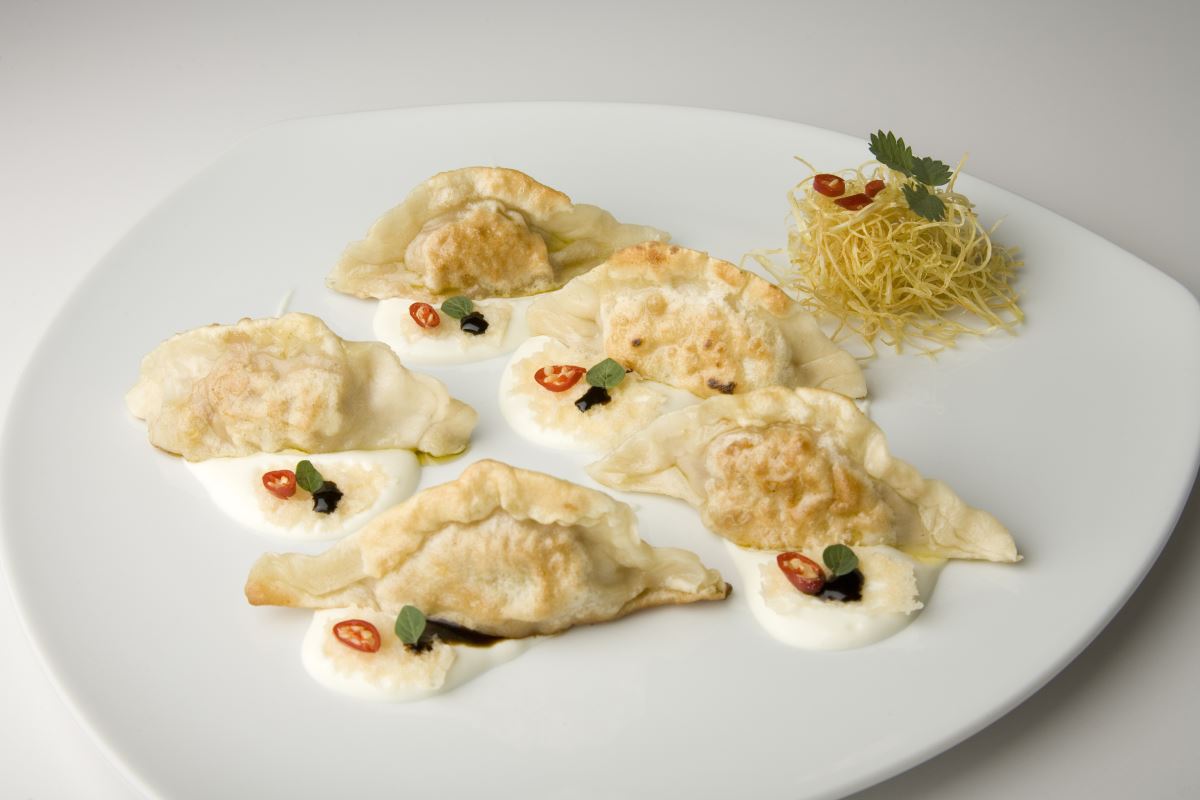 Raviolis salteados con crema de Taleggio