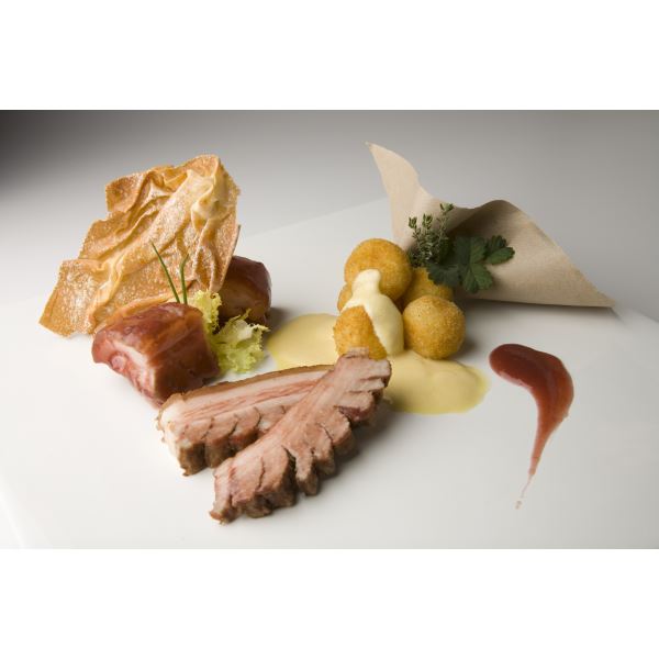Steamed pork with beans, rice balls and Grana Padano fondue 