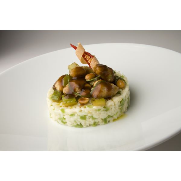 Stir-fried pork cubes with Carnaroli rice timbale and green peppers 