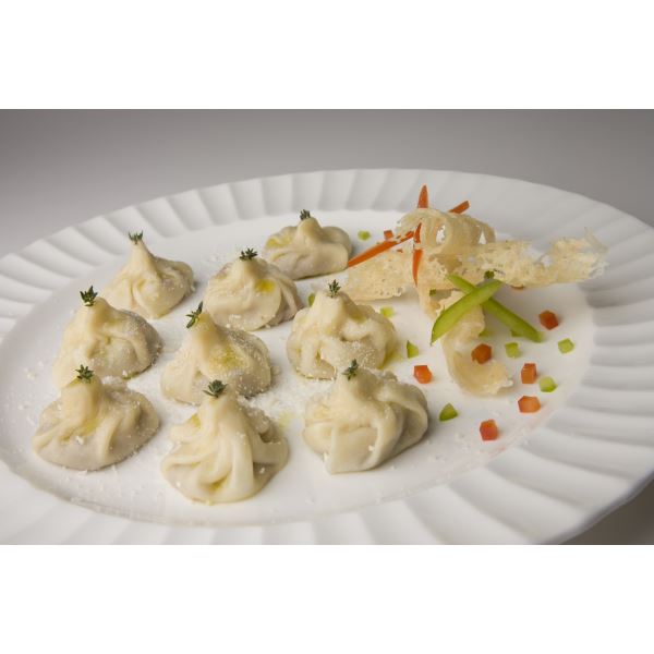 Tasty steamed dumplings with four cheese sauce
