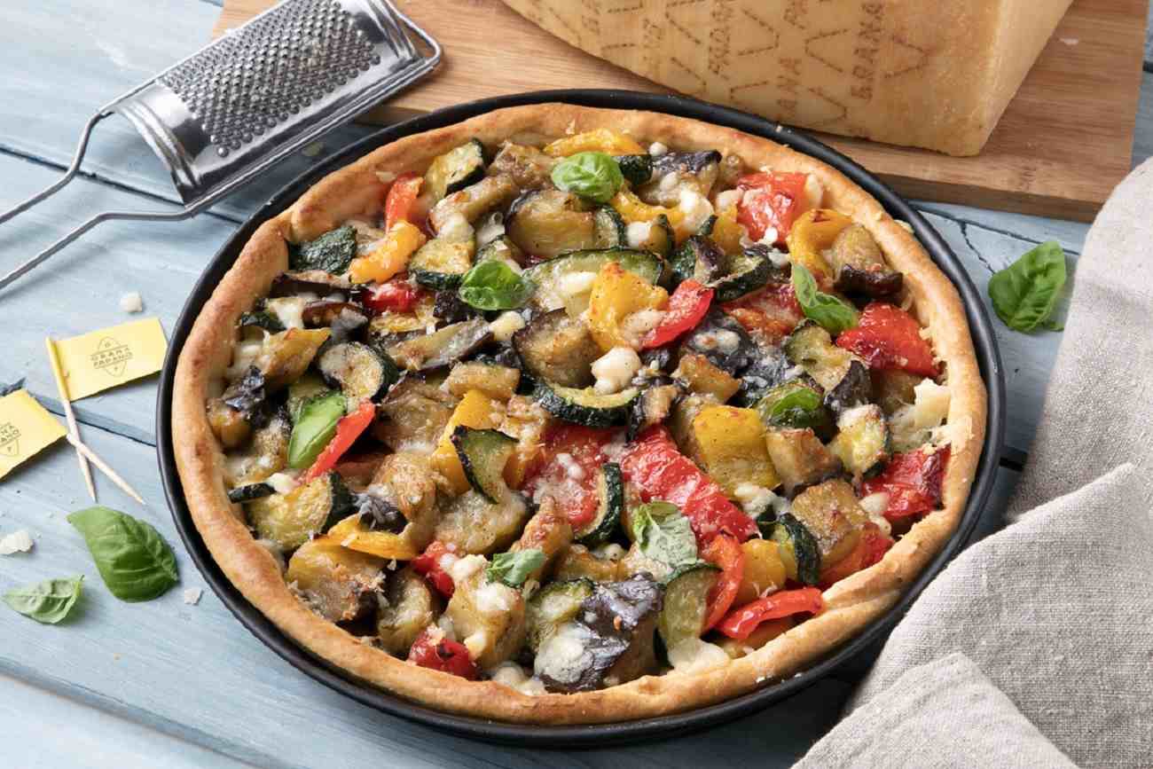 Savoury pie with vegetable ratatouille (aubergines, courgettes, peppers, onions) and Grana Padano Riserva