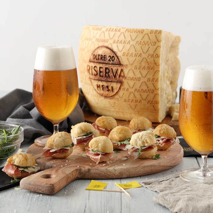 Savoury dough “zeppole” with ham, rocket and shavings of Grana Padano Riserva - served with bock beer 
