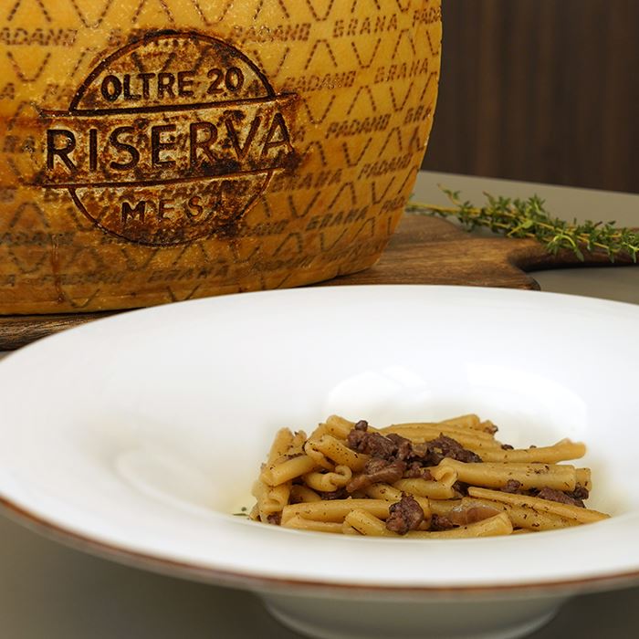 Caserecce al ragù di salsiccia con fonduta di Grana Padano Riserva