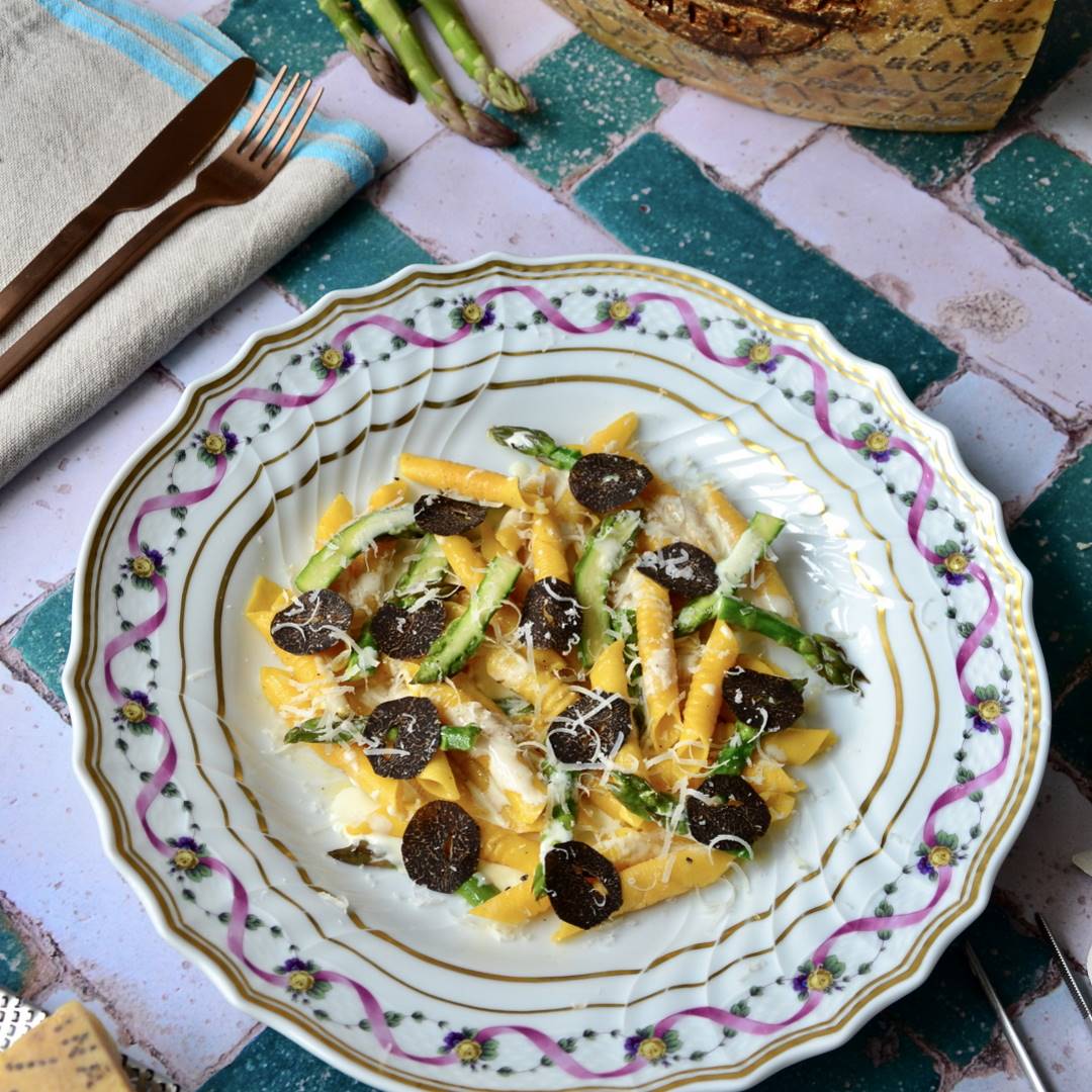 Homemade garganelli with asparagus, Grana Padano sauce and black truffle