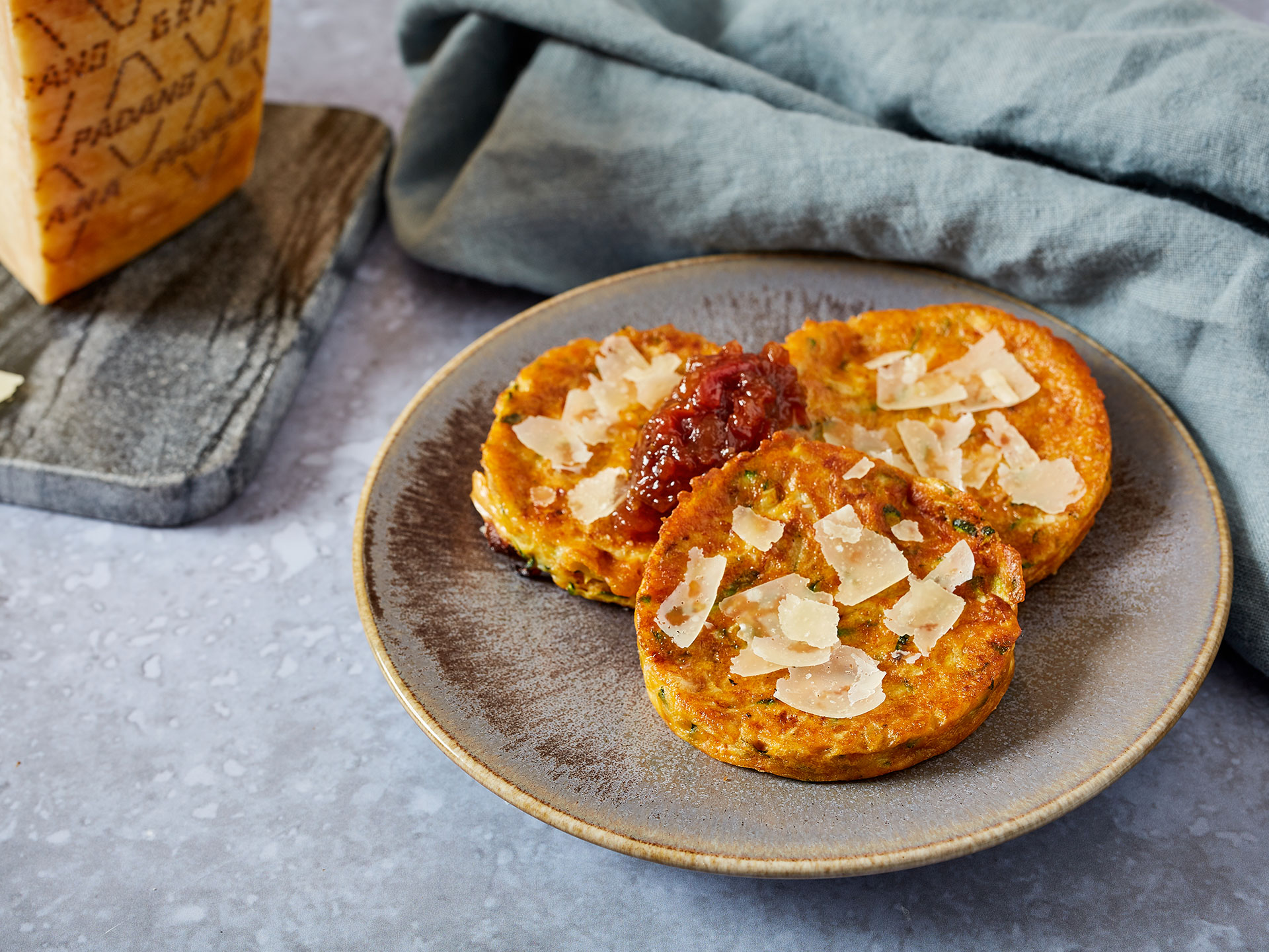 Courgette and Grana Padano pancakes with tomato and apple relish