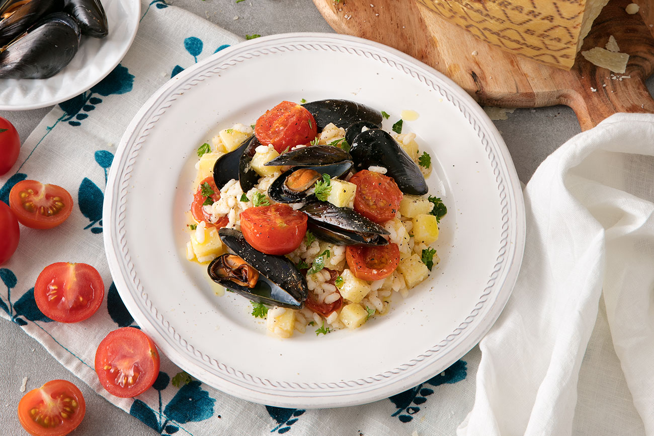 Arroz con mejillones, patatas, tomaotes y Grana Padano Riserva