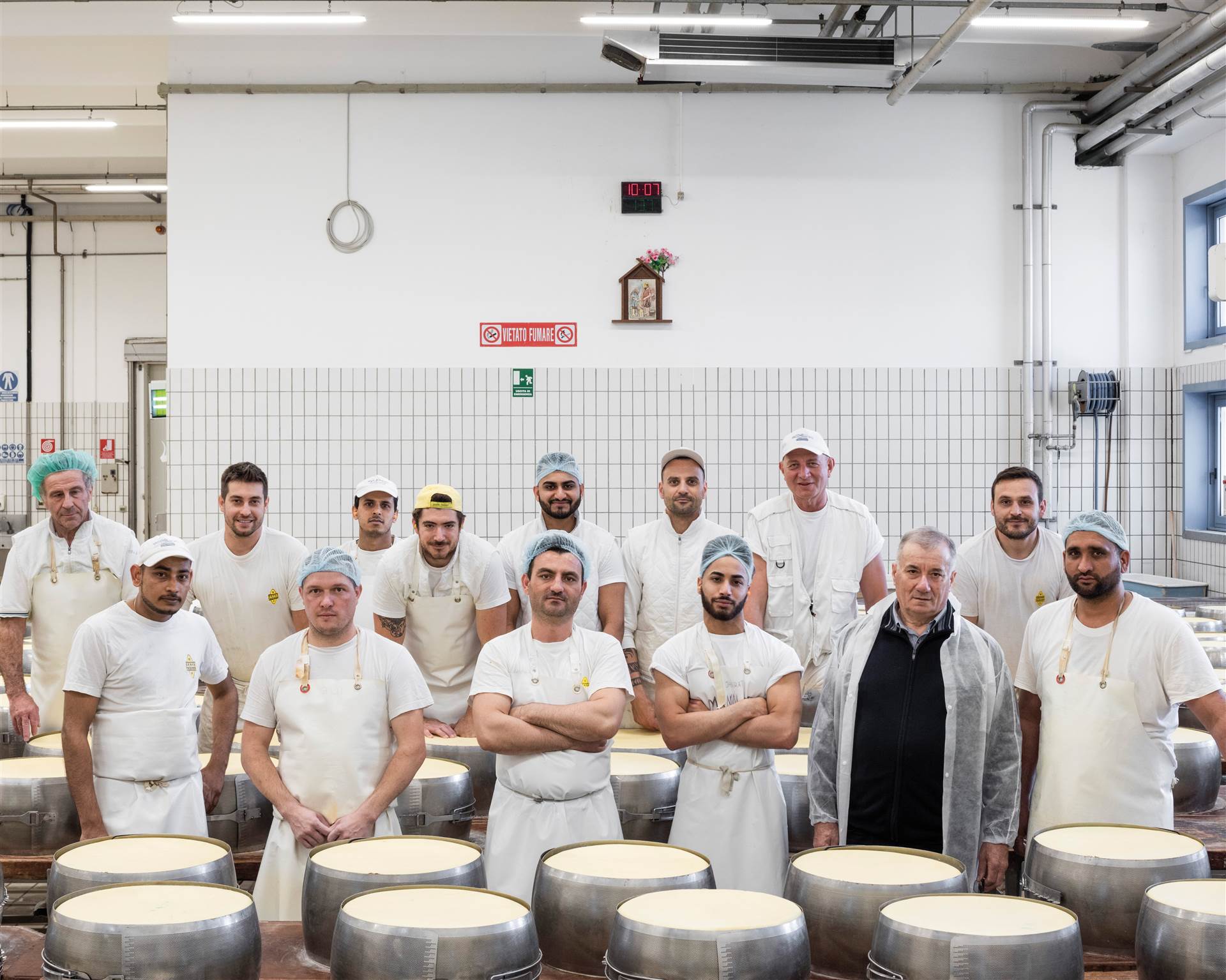 The team of technicians working in the dairy. &lt;br&gt;In the front row, second from the right, the president of the cooperative, Renato Zaghini