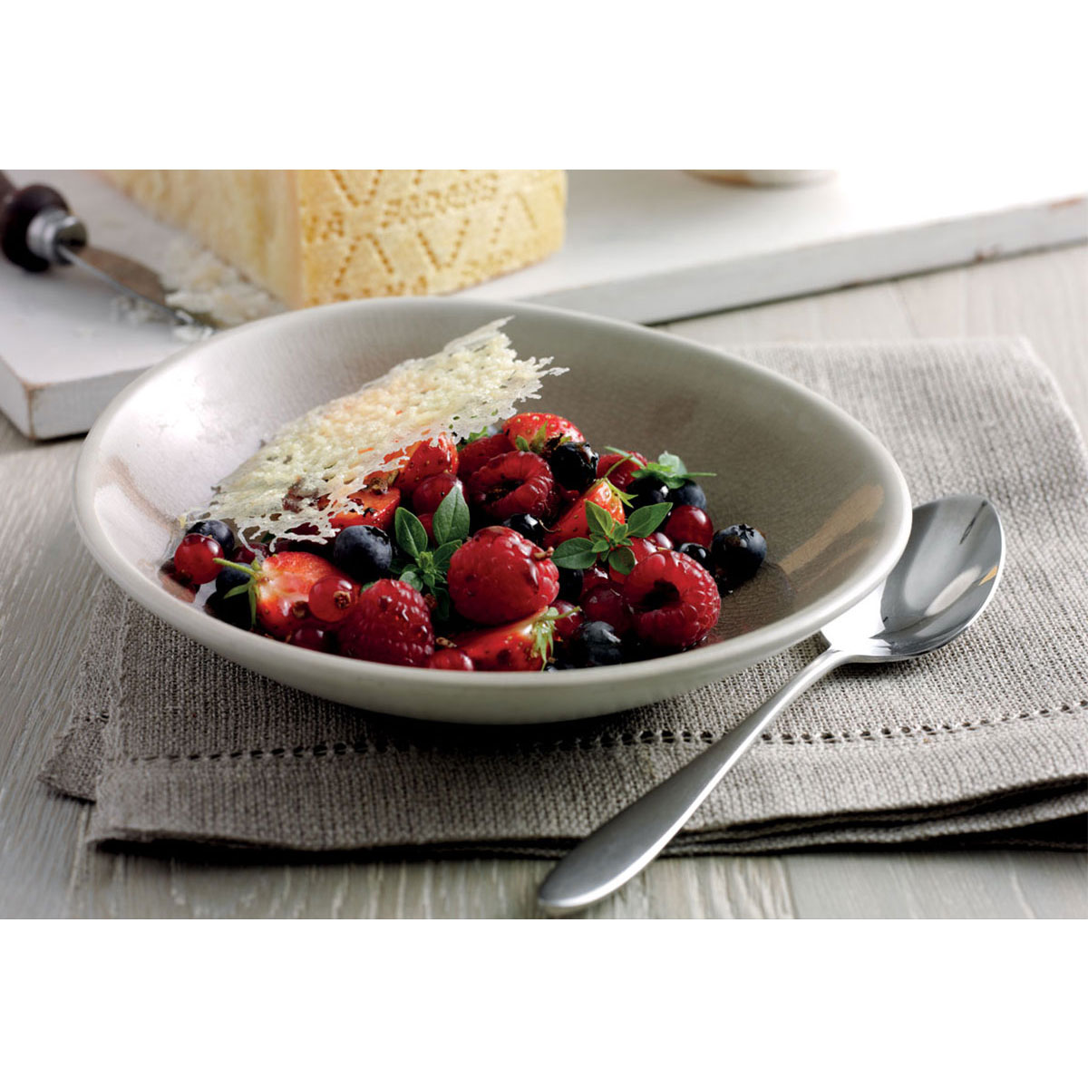 Wild berry salad with basil, mosto cotto, sichuan pepper & Grana Padano crisps