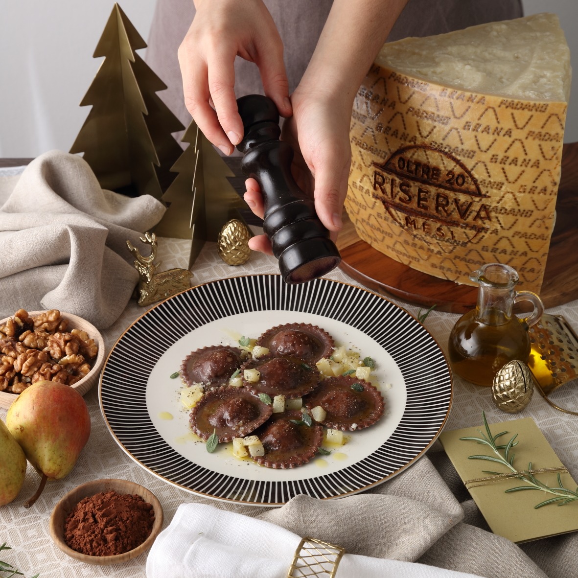 Cocoa ravioli with Grana Padano Riserva and pear filling