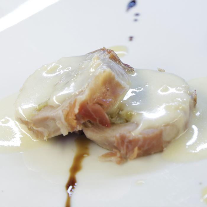 Turkey stuffed with Grana Padano and speck, slowly cooked and paired with a taleggio sause