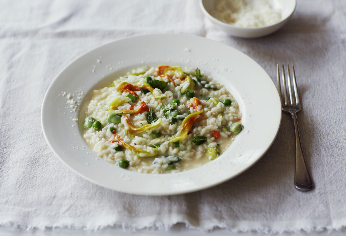 Risotto with broad beans, peas, courgette flowers, Grana Padano and