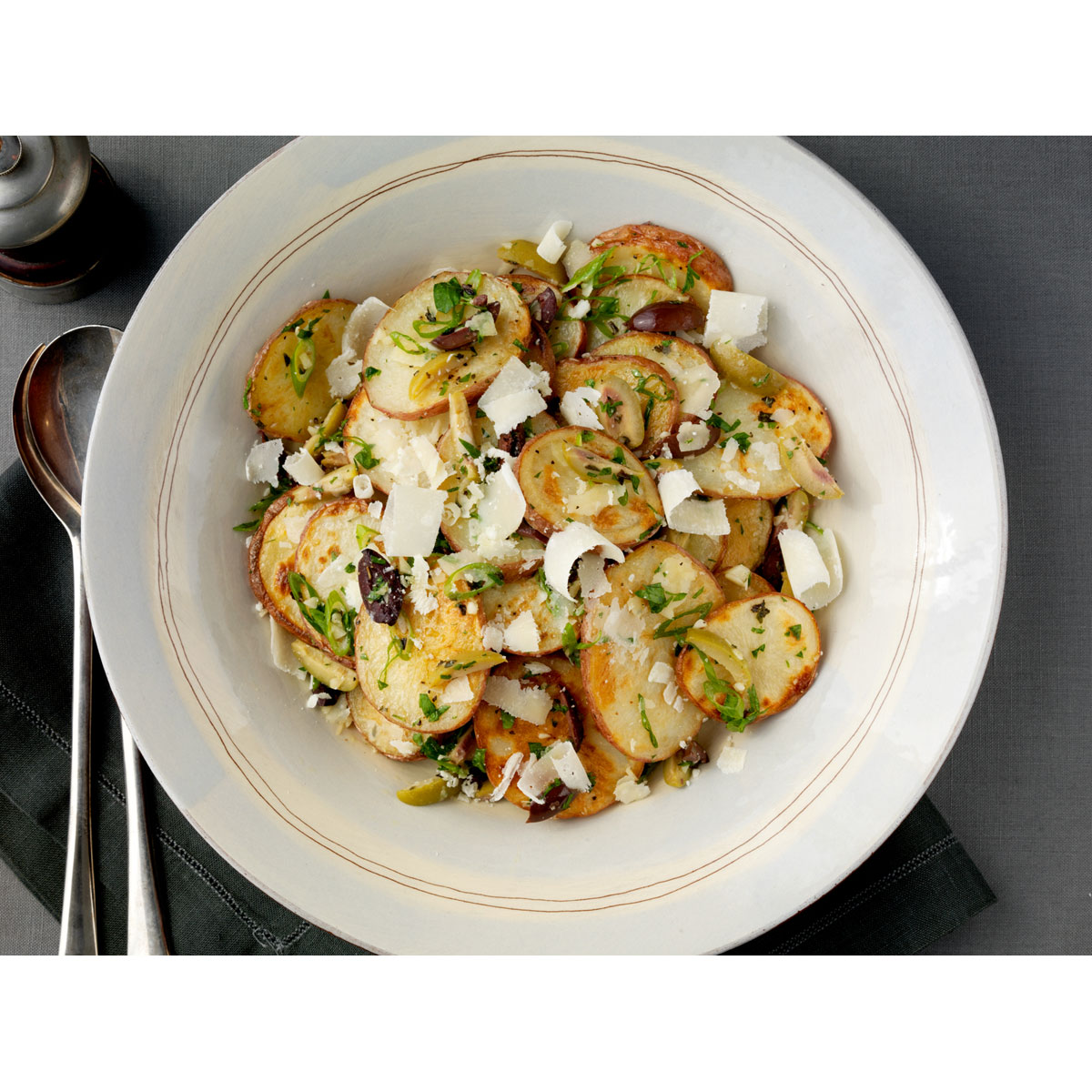 Roasted potato salad with Grana Padano and olives