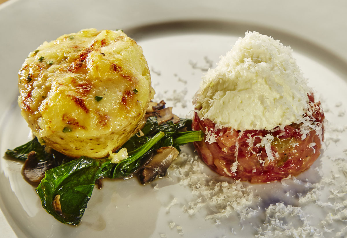 Stuffed potatoes with grappa, Grana Padano mousse, spinach and beef tartare