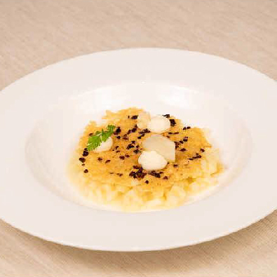 Risotto con pastinaca e pere cialda di cacao amaro e crema di Grana Padano p